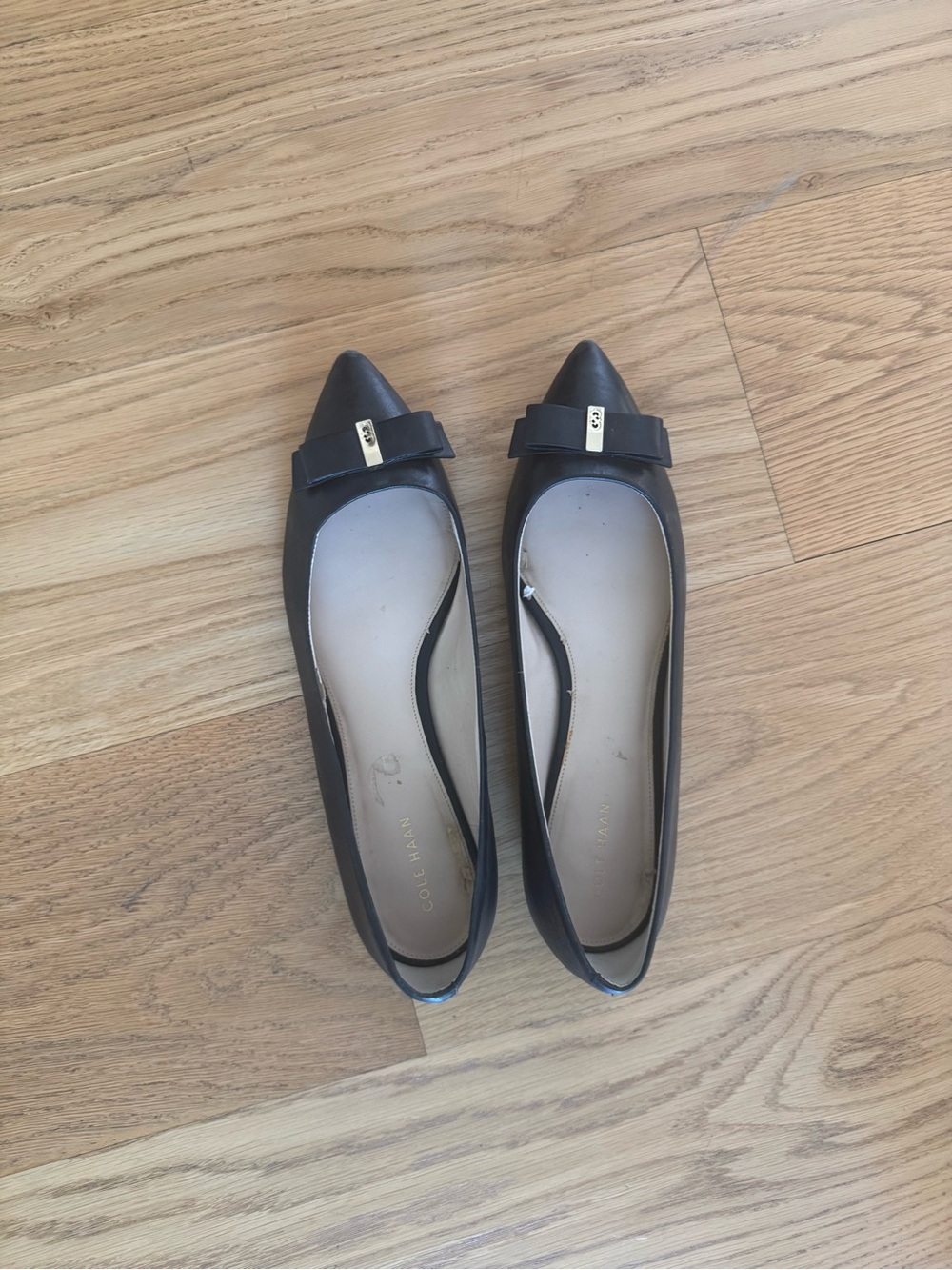 Cole Haan Black Pointed-Toe Bow Flats with Gold Accent
